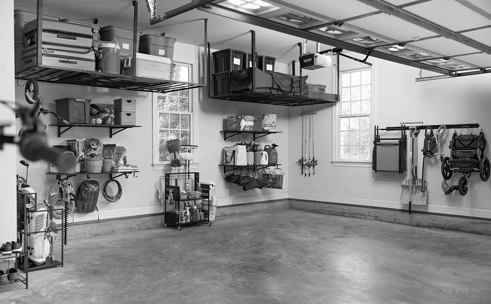 An organized garage with overhead racks, wall shelves and a clear floor